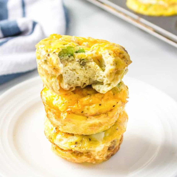 Stacked egg muffins on a plate.