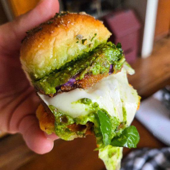 Golden brown buns, bright green pesto, melty mozzarella, and fresh green basil.