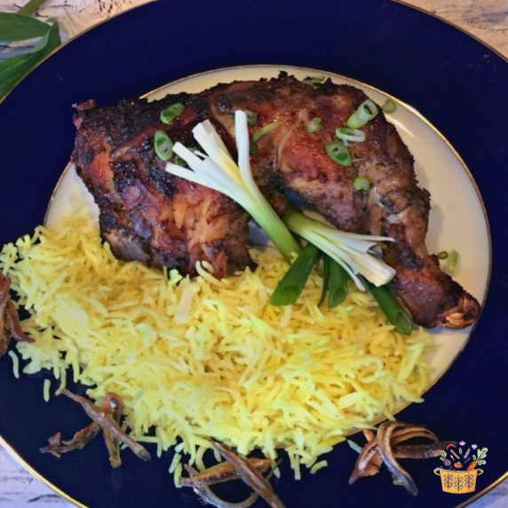 Five Spice Chicken with rice on a blue and white plate