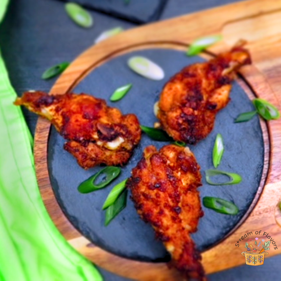 Five-Spice Chicken Wings with five-spice powder, brown sugar, garlic, pepper, galangal on a plate