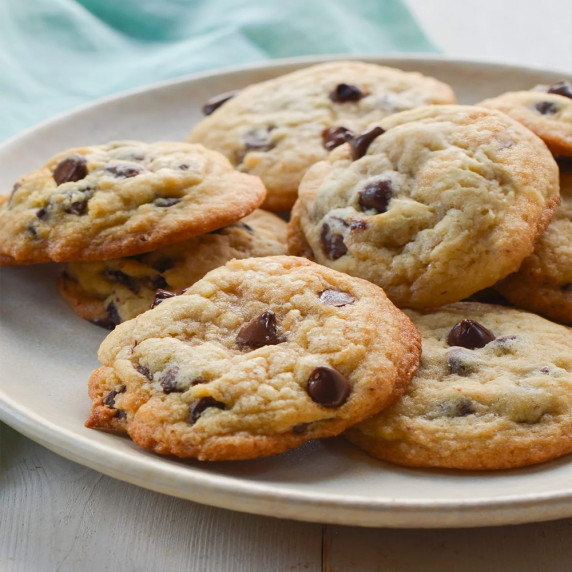 Freshly baked chewy chocolate chip cookies on a plate