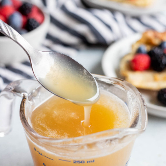Buttermilk syrup in a liquid measuring cup.