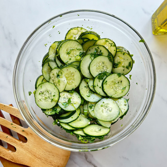 finished german cucumber salad in glass bowl