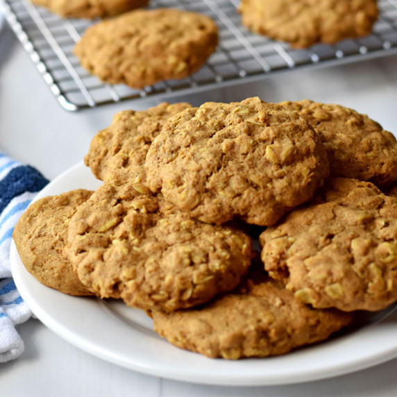 Stack of gluten free pumpkin oatmeal cookies on a white plate.