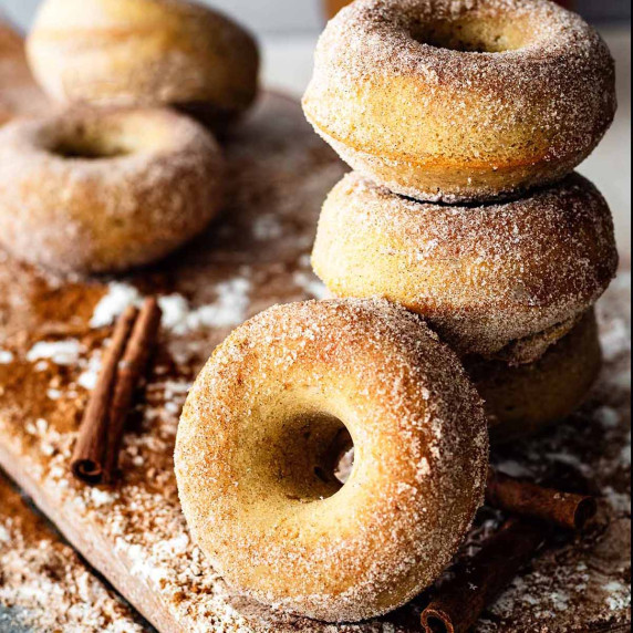 Close up of a stack of gluten free apple cider donuts