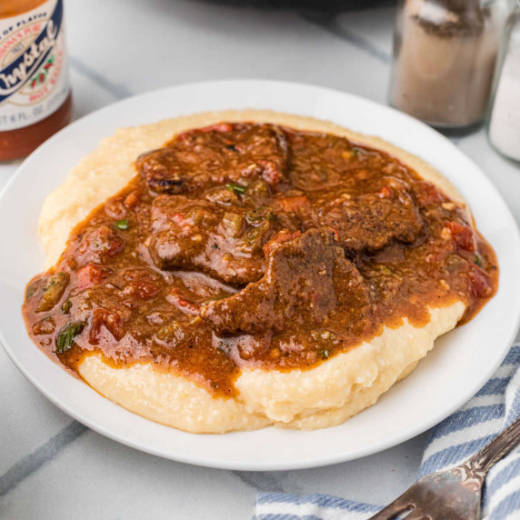 Delicious beef grillades over cheesy grits.