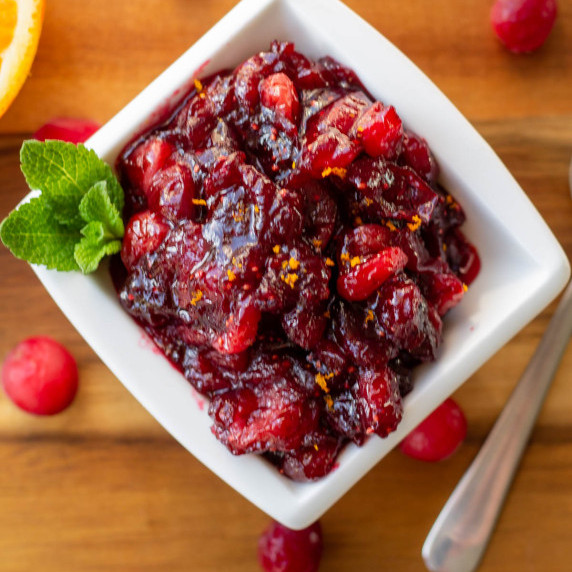 Homemade cranberry sauce in a white square dish