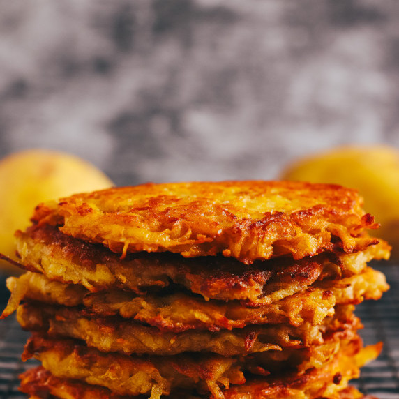 A stack of crispy potato fritters 