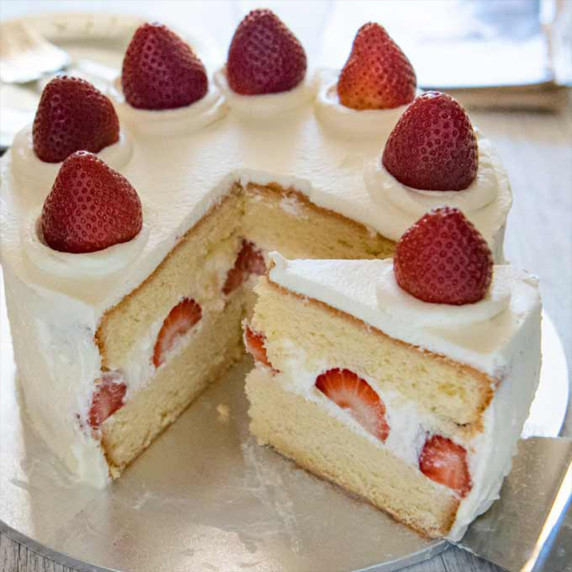 Homemade strawberry cake with fresh strawberry frosting, perfect for celebrations