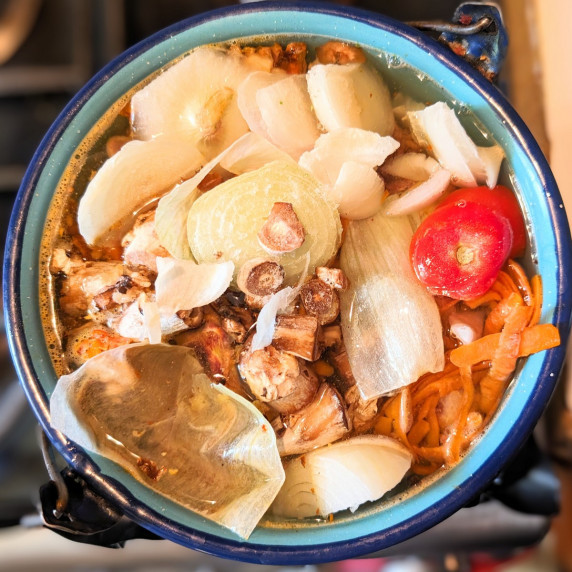 kitchen scraps in a pot with water to make homemade stock