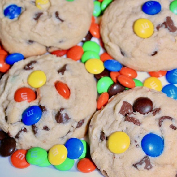 Chocolate Chip Cookies with M&M candies on a white plate with M&M candies.