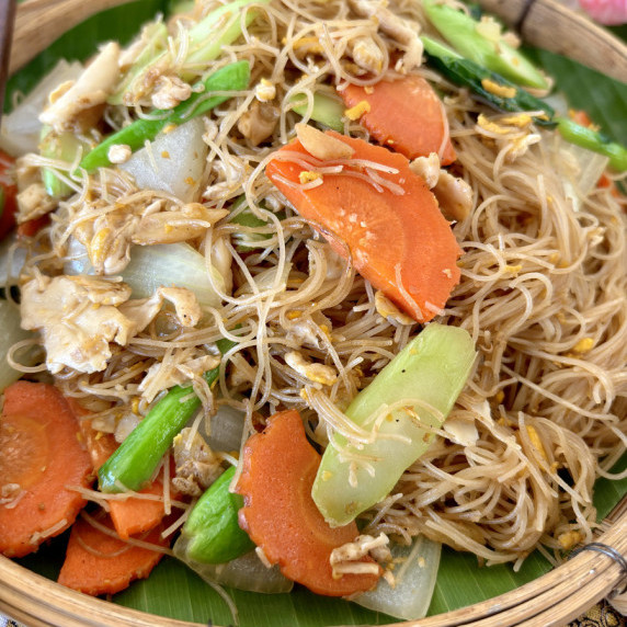 Close-up of sen mee pad see ew, rice vermicelli stir-fry with vegetables and egg.
