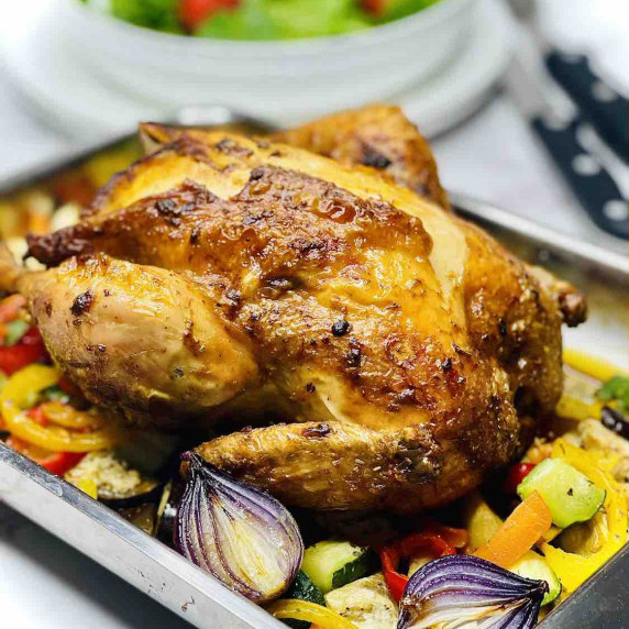 Roast Chicken in a pan with veggies