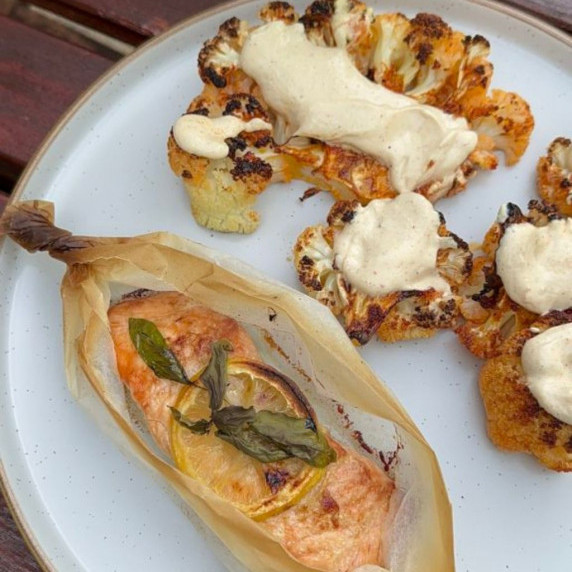 Salmon en Papillote ( Salmon in Parchment)  ssrved witn roasted cauliflower steaks and tahini sauce