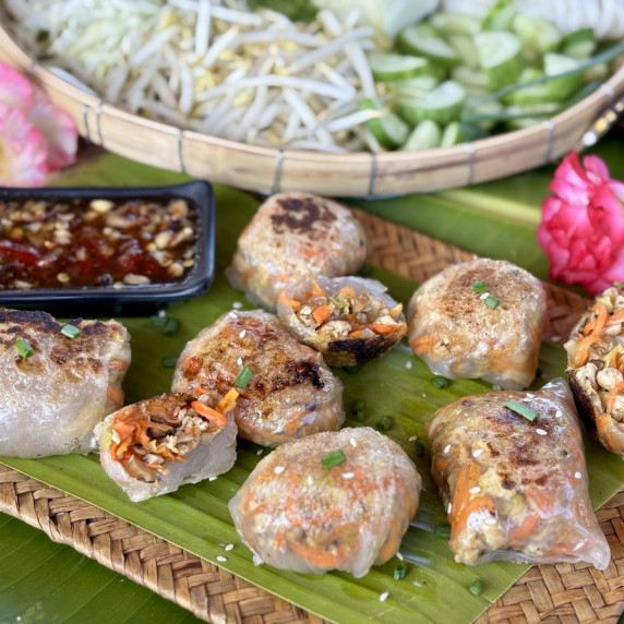 Crispy rice paper dumplings served with dipping sauce.