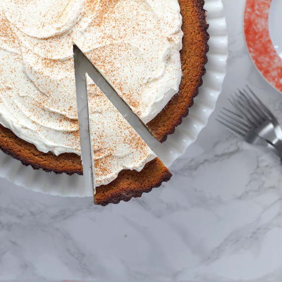 butternut squash pie with whole clove infused whipped cream and a ginger snap cookie crust