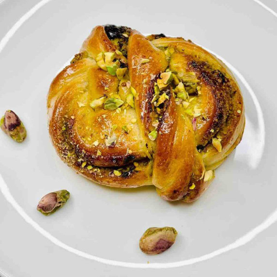 Pistachio Babka Bun on a white plate 