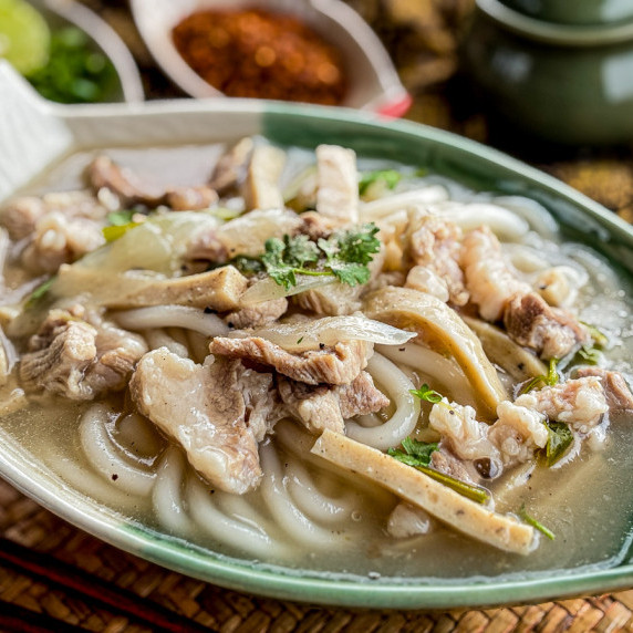 Lao noodle soup, khao piak sen, served in a traditional bowl.