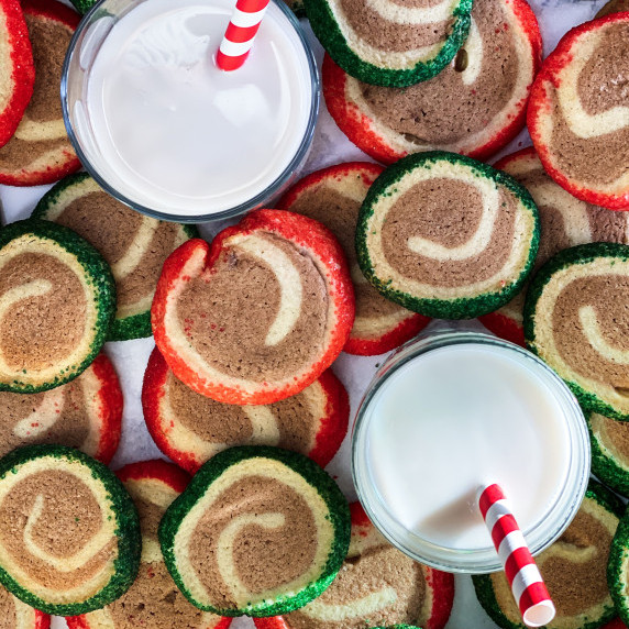 Christmas Pinwheel cookies with glasses of milk