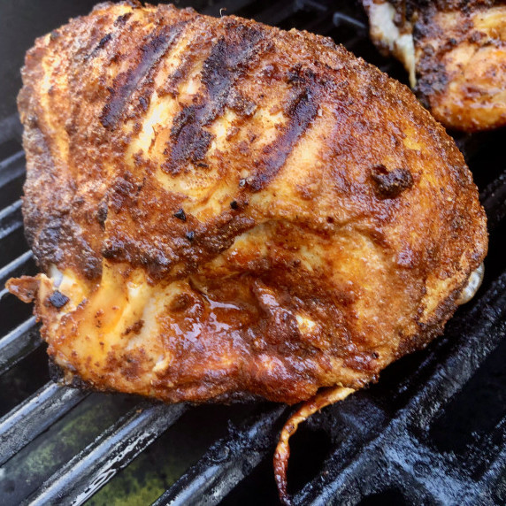 Grilled chicken on grill grates with Tandoori spices by Sear Marks