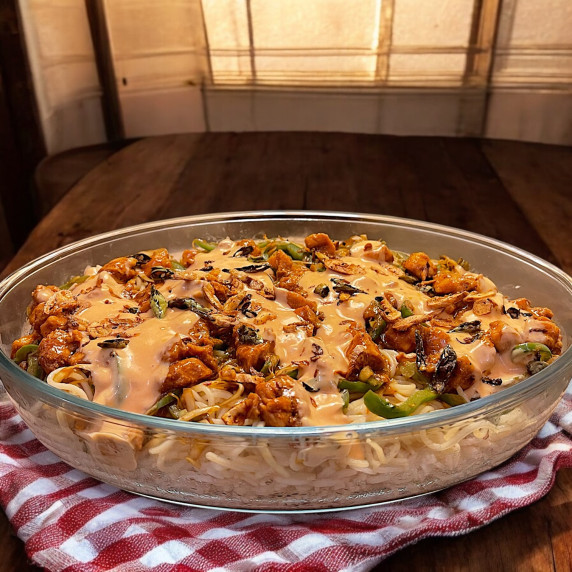 Singaporean rice dish places on kitchen counter 