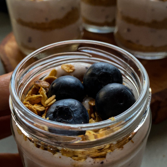 Healthy cheesecake biscuit layers in a jar