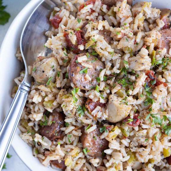 Instant Pot Jambalaya RECIPE served in a white bowl with a spoon.
