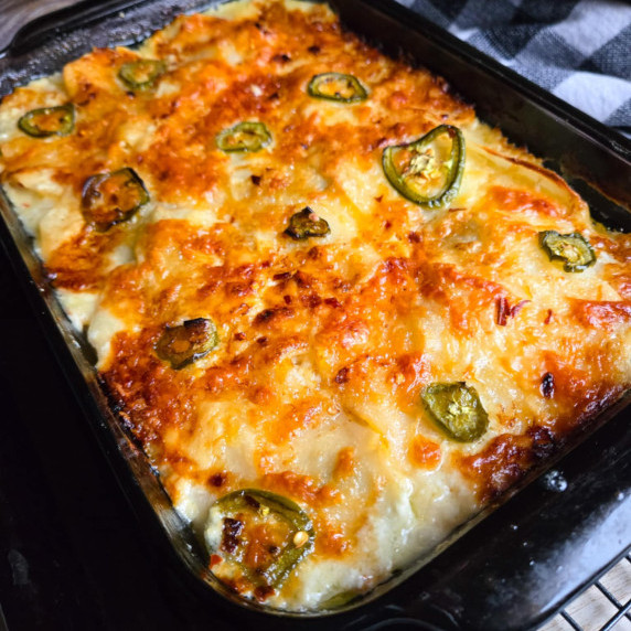 Golden brown potatoes with sliced green jalapenos