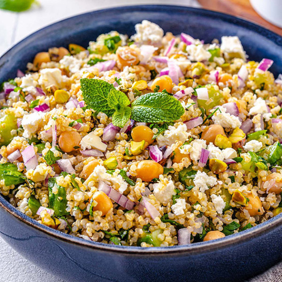Photo of a salad with quinoa, chickpeas, feta,  and pistachios