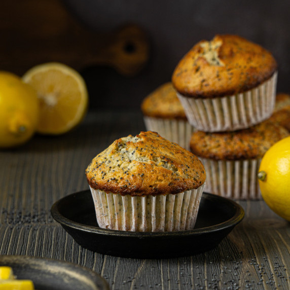Lemon poppy seed muffins on a dark background