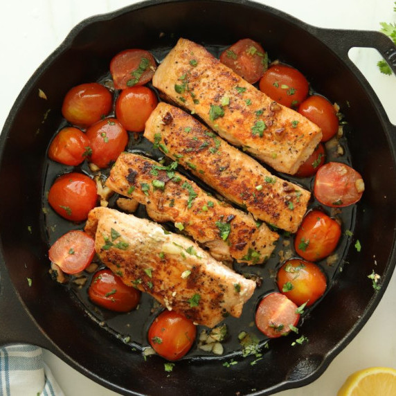 Cast Iron skillet with pan seared lemon garlic salmon