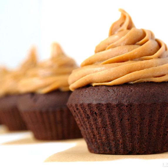 Dark chocolate cupcake topped with a tall swirl of peanut butter caramel.