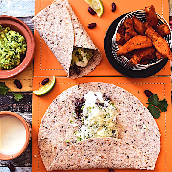 Cheese and bean burrito with avocado salsa and sweet potato chips