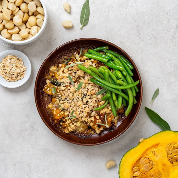 Macadamia crumble pot with green beans in a brown bowl