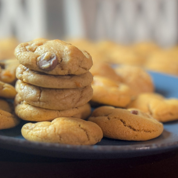 Stack of Maple Caramel Cookie Butter Chocolate Chip Cookies on a Blue Plate