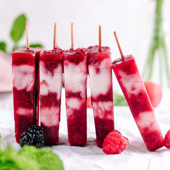 masala berry popsicles lined up in a row