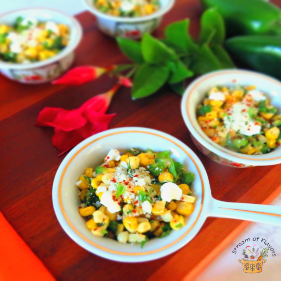 Mexican Corn Salad Esquite with corn kernels, cheese, chili, salt, lime juice, and cilantro