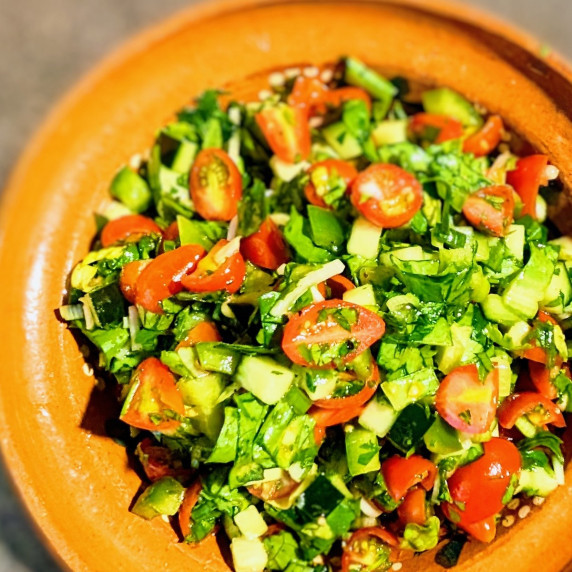 Middle Eastern chopped salad in a clay bowl