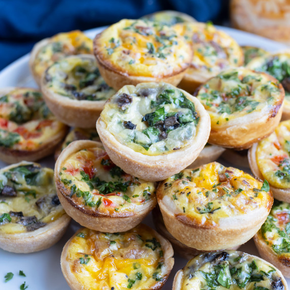 Mini Quiche RECIPE stacked on top of each other.