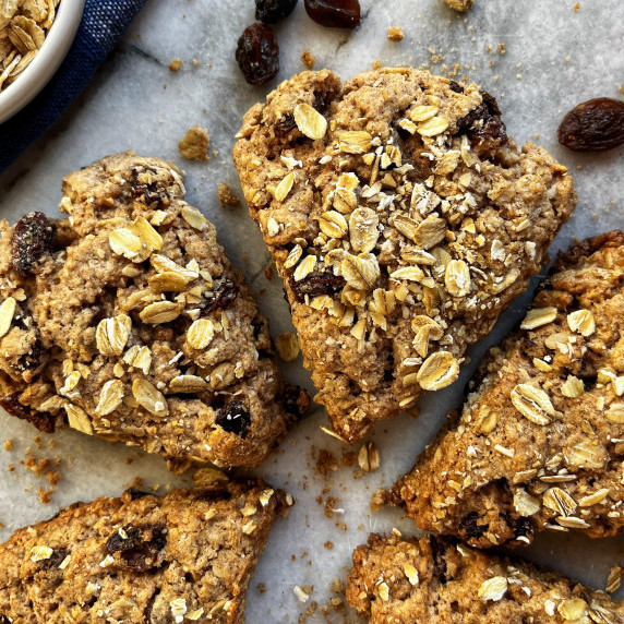 Oatmeal raisin scones on a marble board.