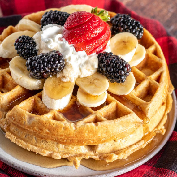 oatmeal waffles with fruit and maple syrup