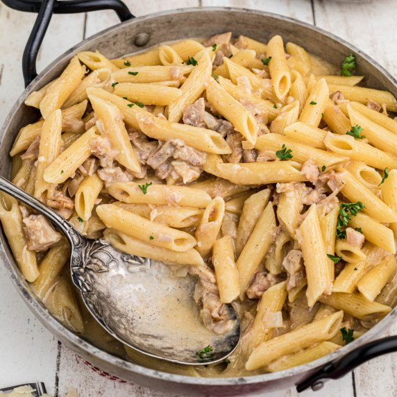 A skillet with a one pot turkey pasta recipe.