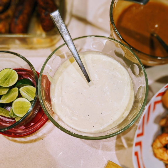 roasted jalapeno aioli in a bowl on a table with other summer barbecue items