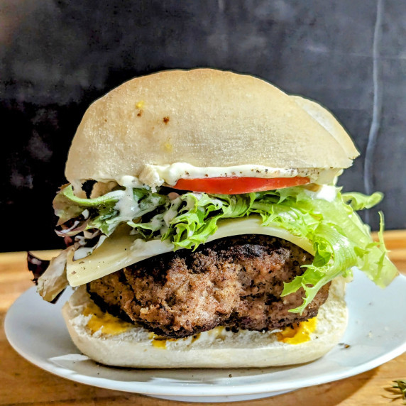 Turkey Burgers with lettuce, tomato, mustard and Mayo.