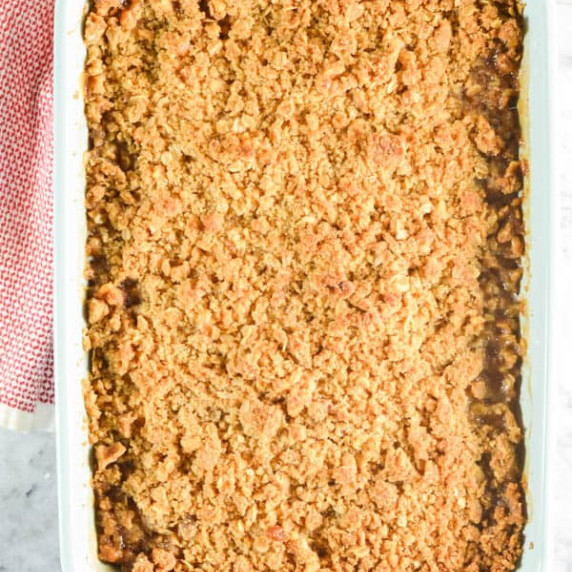 A down shot of Pear Crisp in a light blue pan. 