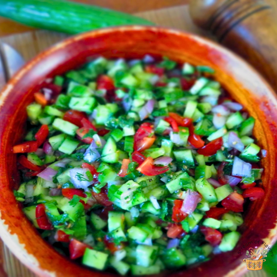 Persian Shirazi Salad with onion, tomatoes, cucumbers, olive oil, lime, mint, and sumac