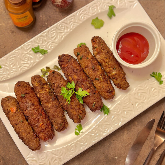 Seekh kebab made with beef placed on the white dish