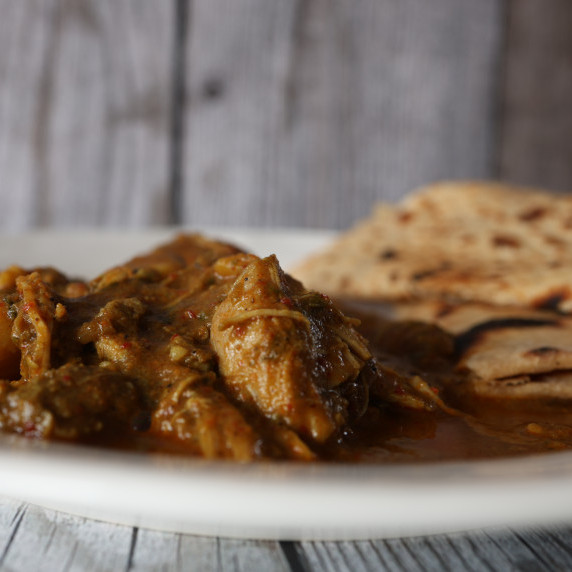 Chicken in a curry gravy with chapati