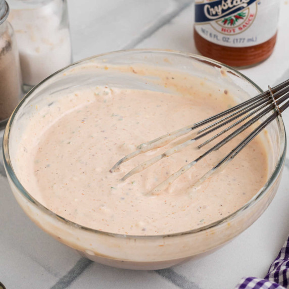 Close up of a bowl full of remoulade sauce.