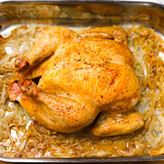 French Onion Roast Chicken in roasting pan. 